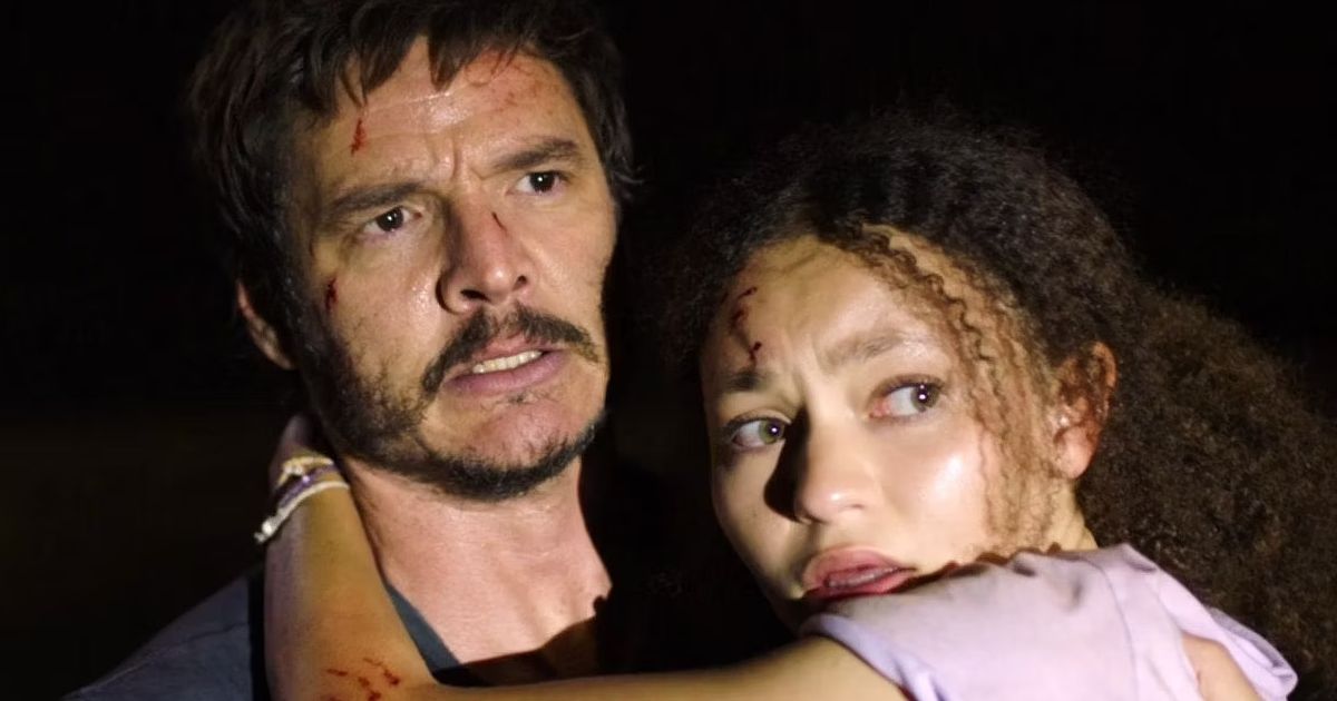 Pedro Pascal as Joel Miller and Nico Parker as Sarah Miller in The Last of Us.